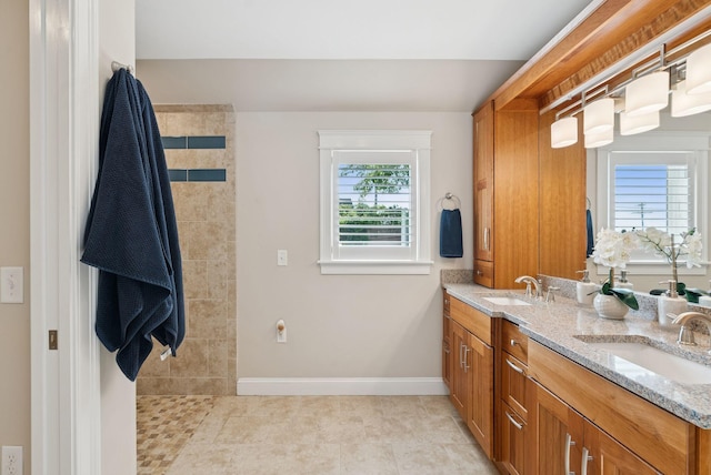 25 Ocean Ave, Cape Elizabeth, ME 04107 - full bath with double vanity, baseboards, a walk in shower, and tile patterned flooring