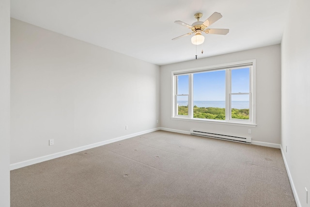 25 Ocean Ave, Cape Elizabeth, ME 04107 - carpeted spare room featuring a baseboard radiator, baseboards, and ceiling fan