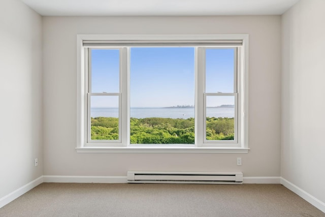 25 Ocean Ave, Cape Elizabeth, ME 04107 - unfurnished room with a baseboard radiator, healthy amount of natural light, carpet flooring, and a water view