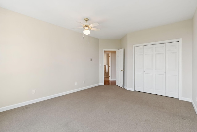25 Ocean Ave, Cape Elizabeth, ME 04107 - unfurnished bedroom with carpet floors, baseboards, a closet, and a ceiling fan