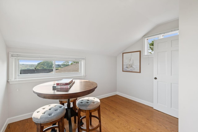 25 Ocean Ave, Cape Elizabeth, ME 04107 - dining area featuring lofted ceiling, baseboards, and light wood finished floors