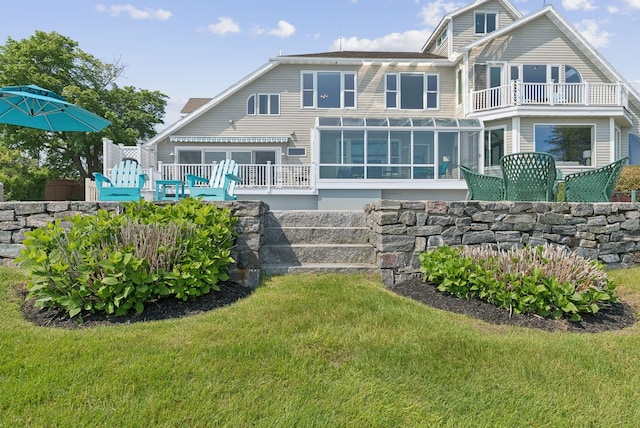 25 Ocean Ave, Cape Elizabeth, ME 04107 - rear view of property featuring a sunroom, a lawn, and a deck