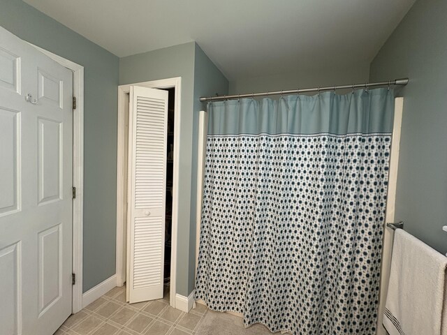 282 Pierces Point Rd, Windsor, ME 04363 - bathroom with curtained shower and baseboards