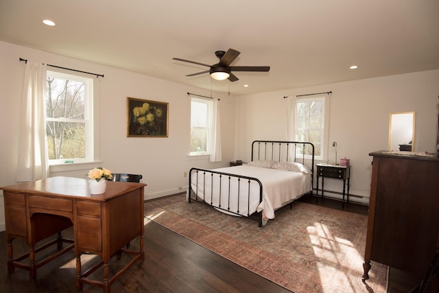 42 Old Mill Rd, Bristol, ME 04554 - bedroom with dark wood-style flooring, a baseboard radiator, multiple windows, recessed lighting, and baseboards