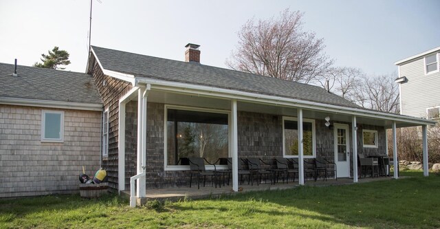 42 Old Mill Rd, Bristol, ME 04554 - rear view of house featuring a chimney, a lawn, and a shingled roof