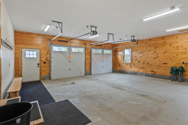 3935 Main St, Rangeley, ME 04970 - garage with wooden walls and a garage door opener