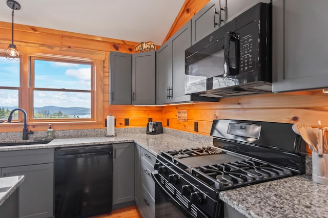 3935 Main St, Rangeley, ME 04970 - kitchen featuring black appliances, a sink, gray cabinetry, healthy amount of natural light, and wood walls
