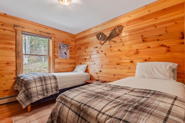 3935 Main St, Rangeley, ME 04970 - bedroom featuring wooden walls and wood finished floors