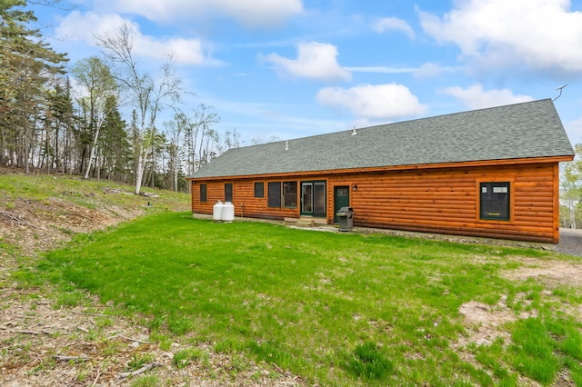 3935 Main St, Rangeley, ME 04970 - back of house with roof with shingles, a yard, and faux log siding