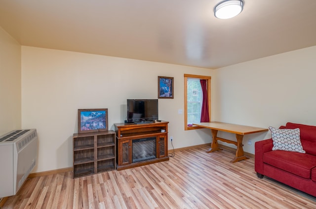 22 Partridge Ln, Medford, ME 04463 - living area featuring wood finished floors, baseboards, and heating unit