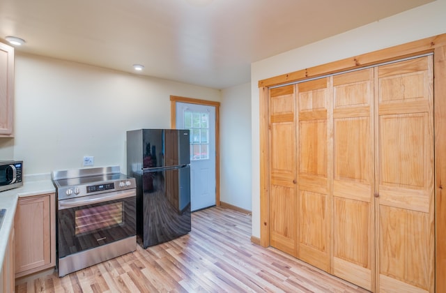 22 Partridge Ln, Medford, ME 04463 - kitchen with stainless steel appliances, light wood finished floors, light countertops, and baseboards