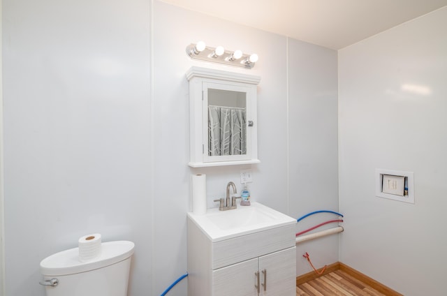 22 Partridge Ln, Medford, ME 04463 - bathroom featuring toilet, vanity, and wood finished floors