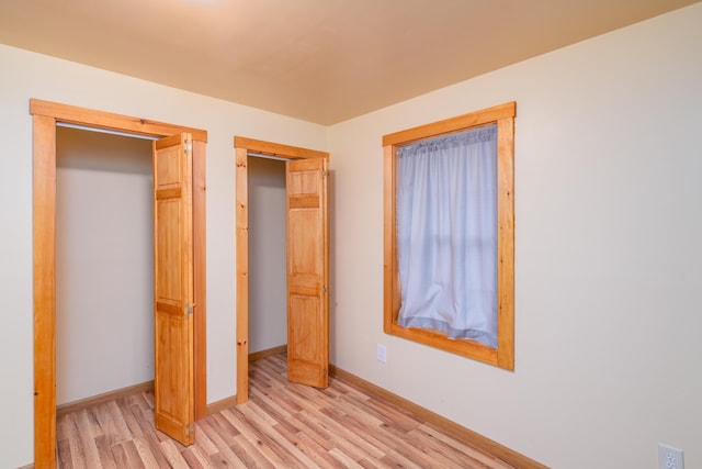 22 Partridge Ln, Medford, ME 04463 - unfurnished bedroom with light wood finished floors and baseboards