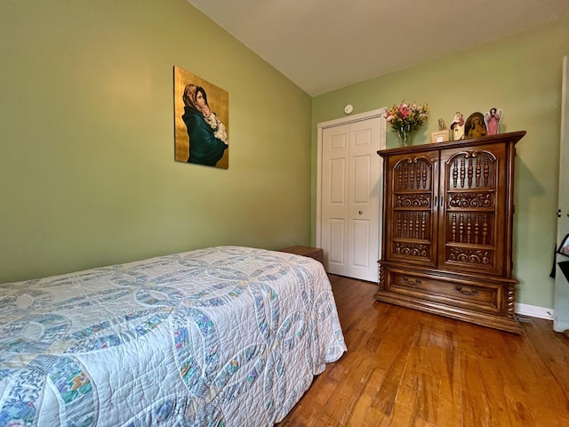 13 Pearl St, Fort Kent, ME 04743 - bedroom featuring wood finished floors and vaulted ceiling