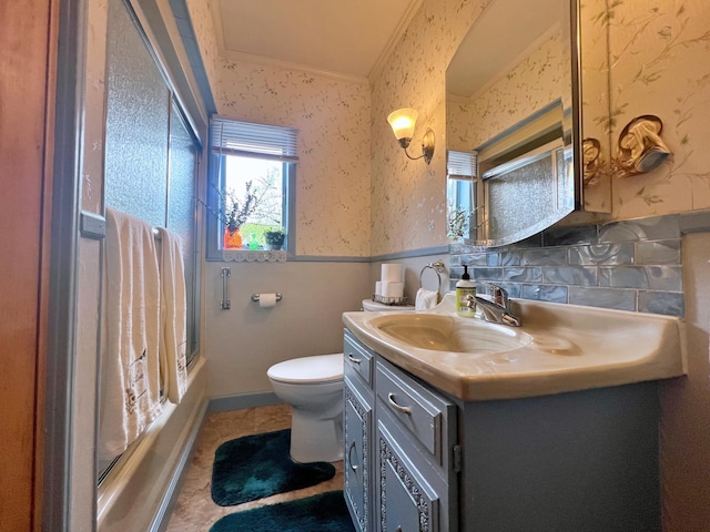 13 Pearl St, Fort Kent, ME 04743 - full bath with wallpapered walls, vanity, toilet, ornamental molding, and  shower combination