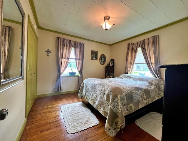 13 Pearl St, Fort Kent, ME 04743 - bedroom featuring crown molding, wood finished floors, and baseboards