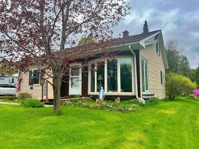 13 Pearl St, Fort Kent, ME 04743 - back of house featuring a chimney and a yard