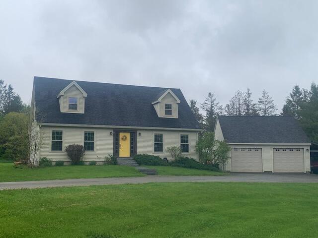 196 Lambert Rd, Brewer, ME 04412 - cape cod home with a front lawn, driveway, an outdoor structure, and entry steps