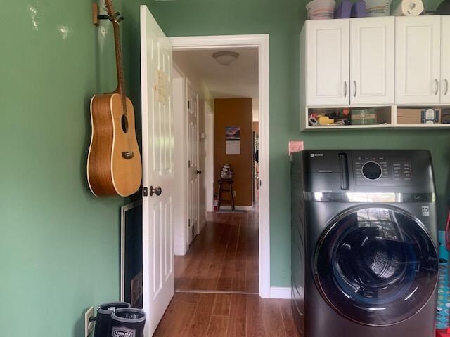 196 Lambert Rd, Brewer, ME 04412 - laundry room with washer / clothes dryer, cabinet space, wood finished floors, and baseboards