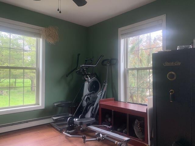 196 Lambert Rd, Brewer, ME 04412 - exercise room featuring plenty of natural light, baseboard heating, and wood finished floors