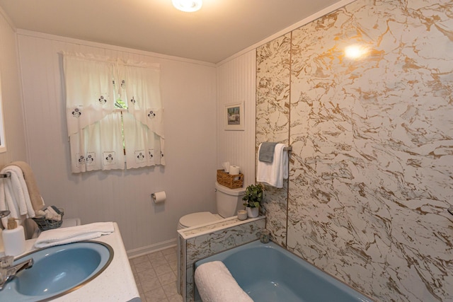18 Julian St, Sebago, ME 04029 - full bathroom with a tub, toilet, baseboards, ornamental molding, and vanity