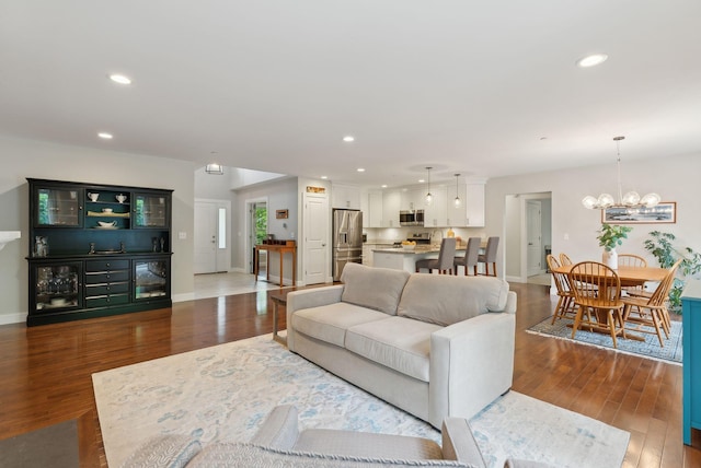 45 S Ridge Rd, Falmouth, ME 04105 - living room with wood finished floors, a chandelier, recessed lighting, baseboards, and beverage cooler