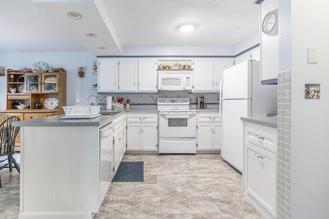 19 Rumery Rd, Lyman, ME 04002 - kitchen featuring white appliances, a peninsula, white cabinetry, and a sink