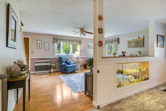 19 Rumery Rd, Lyman, ME 04002 - living room featuring heating unit, healthy amount of natural light, a ceiling fan, and wood finished floors