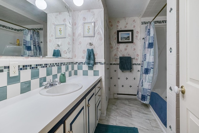 19 Rumery Rd, Lyman, ME 04002 - bathroom featuring vanity, shower / tub combo with curtain, a baseboard heating unit, marble look tiles, and tasteful backsplash
