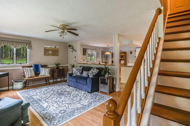 19 Rumery Rd, Lyman, ME 04002 - living room featuring a ceiling fan, stairway, light wood finished floors, and baseboards