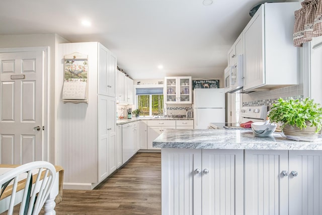 19 Rumery Rd, Lyman, ME 04002 - kitchen featuring white appliances, a peninsula, backsplash, white cabinets, and recessed lighting