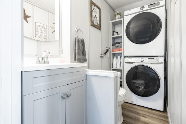 19 Rumery Rd, Lyman, ME 04002 - laundry room featuring stacked washer / drying machine and wood finished floors