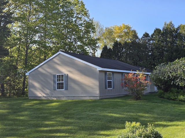 83 Clover Ln, Auburn, ME 04210 - view of side of home with a yard