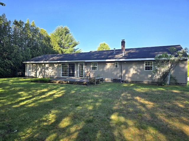 83 Clover Ln, Auburn, ME 04210 - rear view of house with a yard, a wooden deck, and central air condition unit