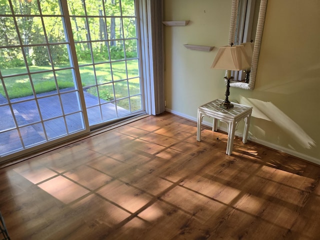 83 Clover Ln, Auburn, ME 04210 - living area featuring baseboards and wood finished floors