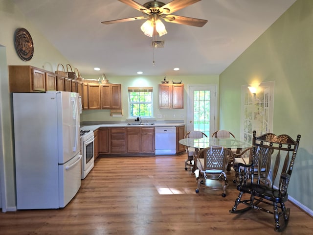 83 Clover Ln, Auburn, ME 04210 - kitchen featuring white appliances, wood finished floors, a sink, light countertops, and recessed lighting