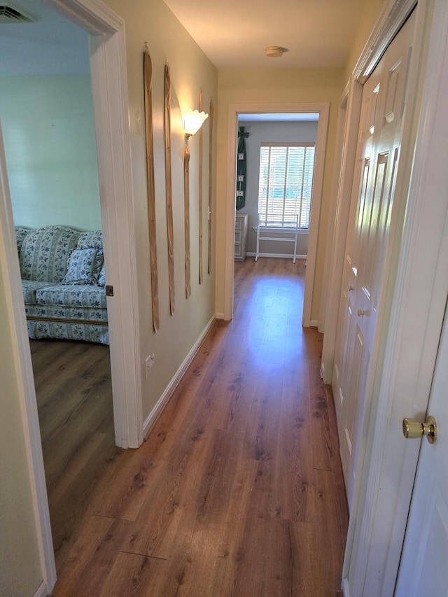 83 Clover Ln, Auburn, ME 04210 - corridor featuring wood finished floors and baseboards