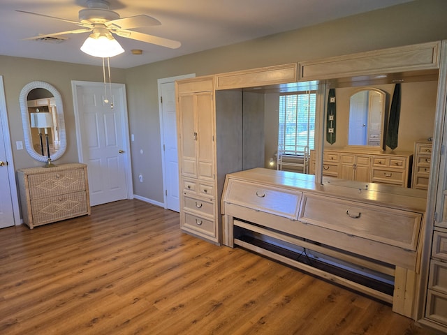 83 Clover Ln, Auburn, ME 04210 - unfurnished bedroom with wood finished floors, ceiling fan, and baseboards
