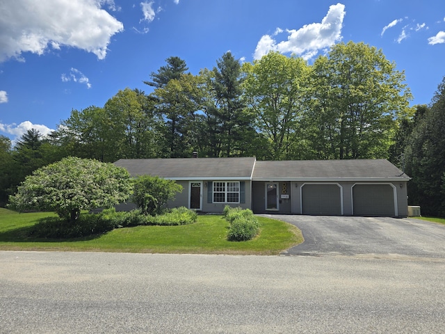 83 Clover Ln, Auburn, ME 04210 - view of front of property featuring an attached garage, driveway, and a front lawn