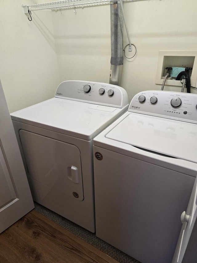 83 Clover Ln, Auburn, ME 04210 - laundry area with dark wood finished floors and washing machine and dryer