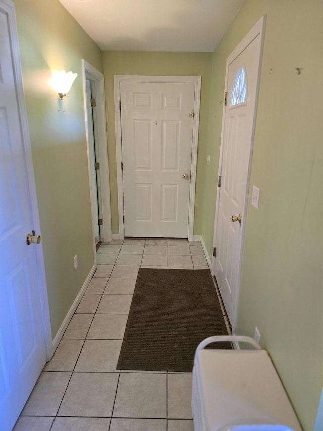 83 Clover Ln, Auburn, ME 04210 - hallway with light tile patterned floors and baseboards