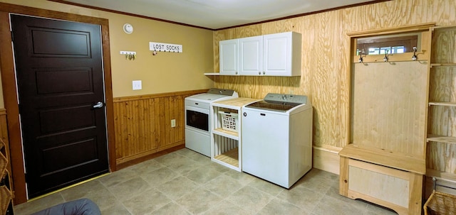 191 Bates St, Pittsfield, ME 04967 - laundry area featuring washing machine and dryer, cabinet space, wood walls, ornamental molding, and wainscoting