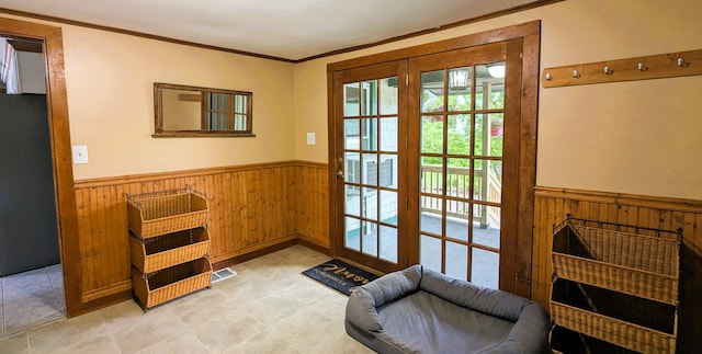 191 Bates St, Pittsfield, ME 04967 - doorway to outside with a wainscoted wall and wood walls