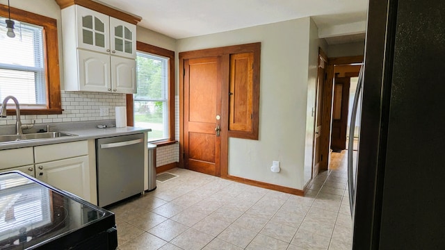 191 Bates St, Pittsfield, ME 04967 - kitchen featuring stainless steel dishwasher, black electric range, plenty of natural light, and light countertops