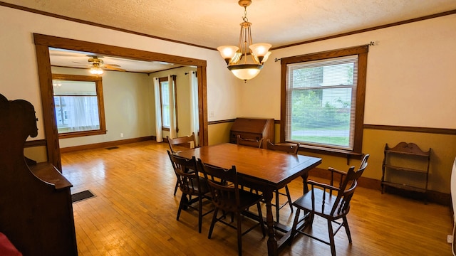 191 Bates St, Pittsfield, ME 04967 - dining room featuring ornamental molding, hardwood / wood-style flooring, a textured ceiling, and ceiling fan