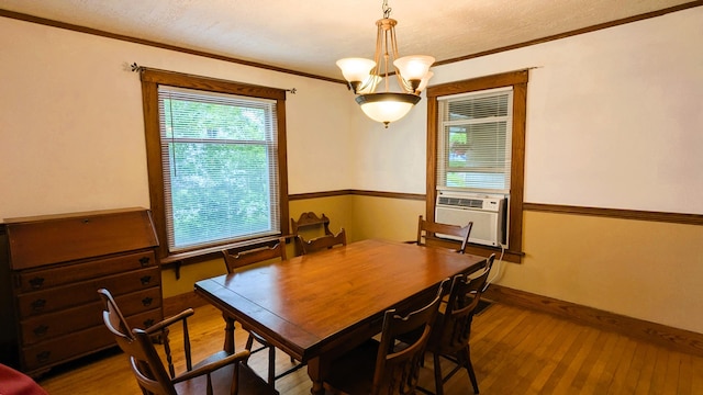 191 Bates St, Pittsfield, ME 04967 - dining room with hardwood / wood-style floors, cooling unit, ornamental molding, and a chandelier