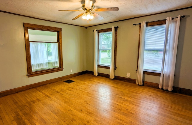 191 Bates St, Pittsfield, ME 04967 - unfurnished room featuring a textured ceiling, light wood-type flooring, ceiling fan, and crown molding