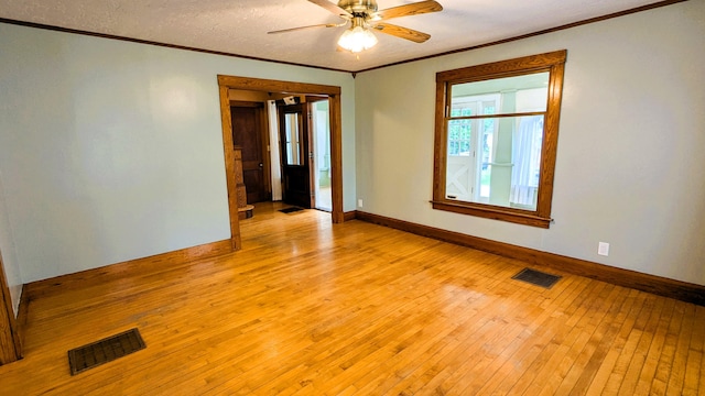191 Bates St, Pittsfield, ME 04967 - spare room featuring crown molding, ceiling fan, and light wood finished floors