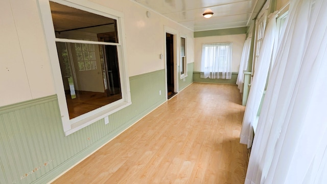 191 Bates St, Pittsfield, ME 04967 - hall featuring light wood finished floors and wainscoting