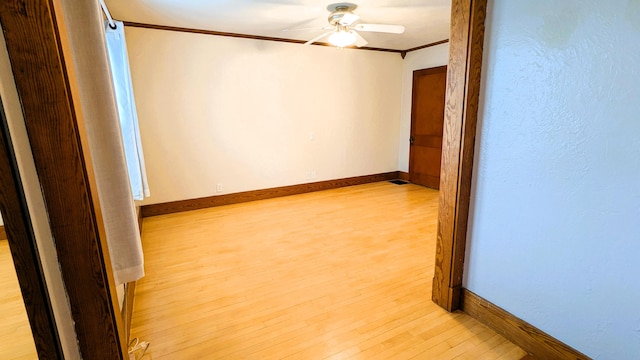 191 Bates St, Pittsfield, ME 04967 - spare room with a ceiling fan, light wood finished floors, and crown molding